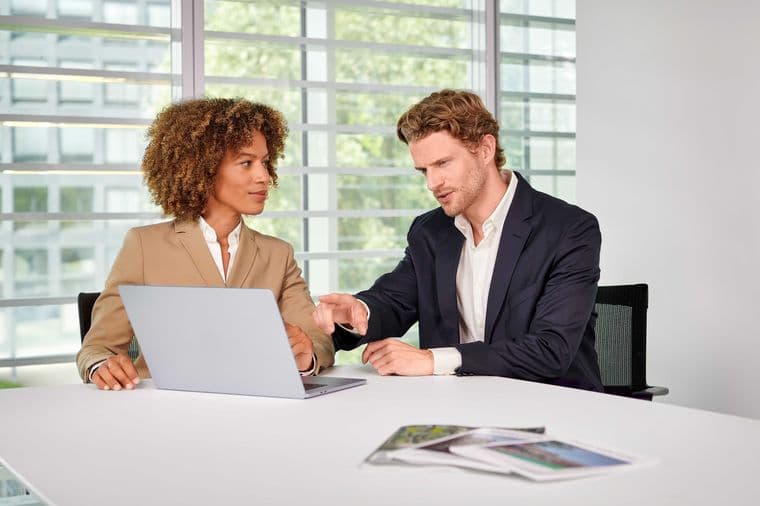 Customer service in the office with a view of a laptop