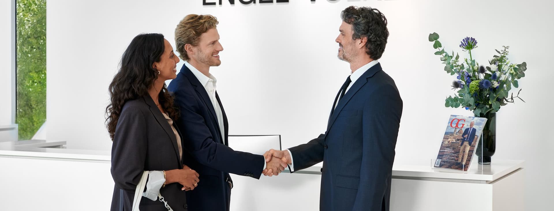 Agent and clients shaking hands