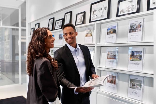 Customer service in the store in front of the display wall