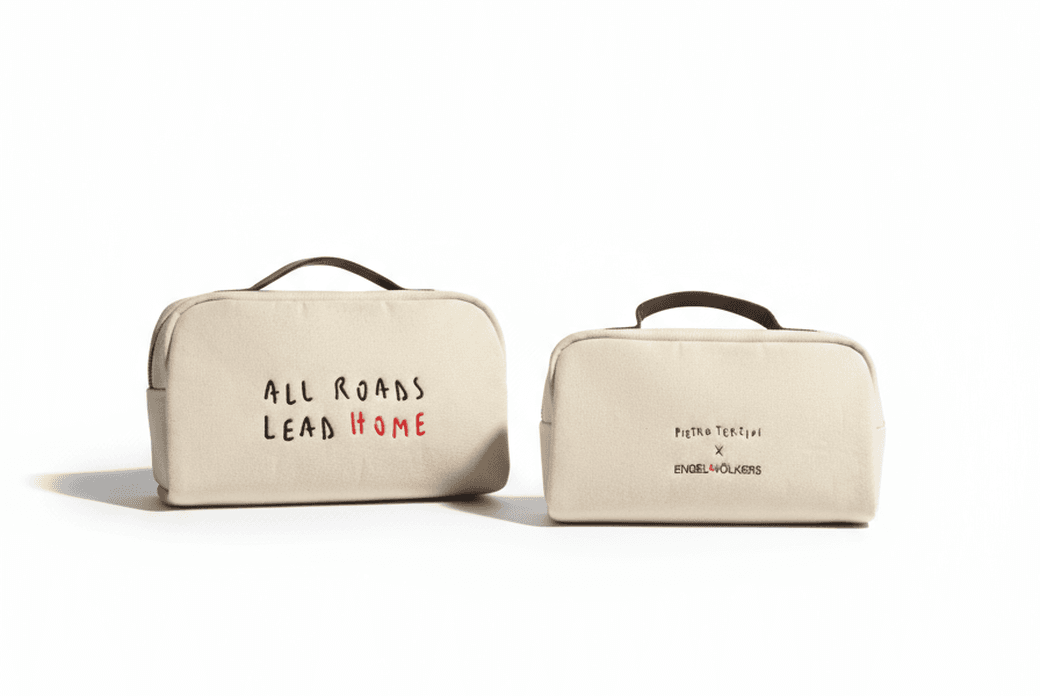 beauty con scritta all roads lead home e dettagli in pelle marrone
