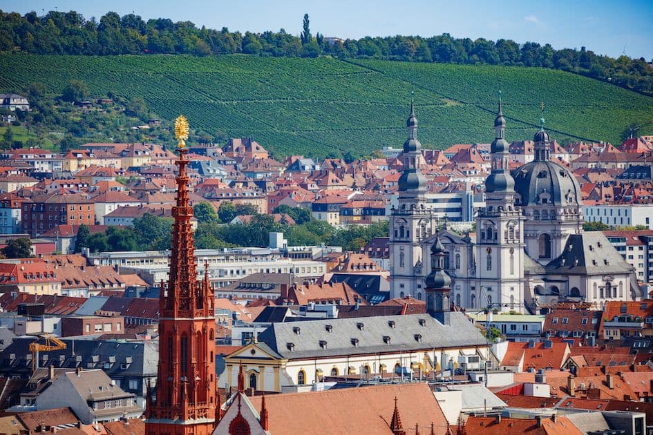 Baroque St. Joseph’s monastery and surrounding vineyards in Würzburg’s Haug district – with red Marienkapelle in the foreground