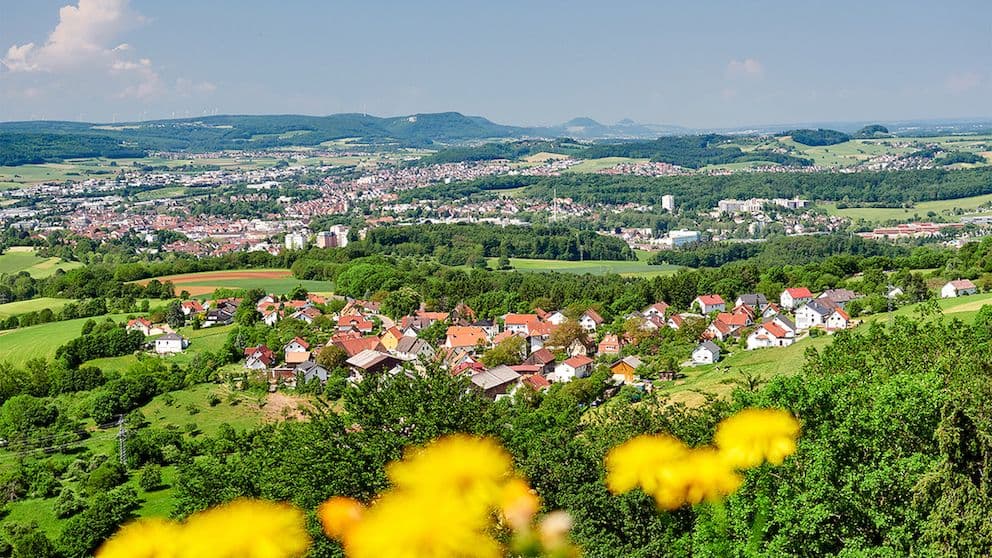 Aalen in Baden-Württemberg, Germany: city center, residential areas and green fields in a panoramic view